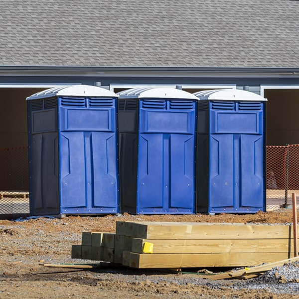 what is the cost difference between standard and deluxe portable toilet rentals in Ackley Iowa